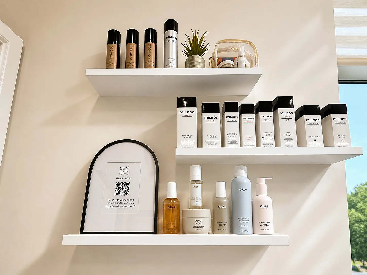 Curated retail shelves — Milbon and OUAI