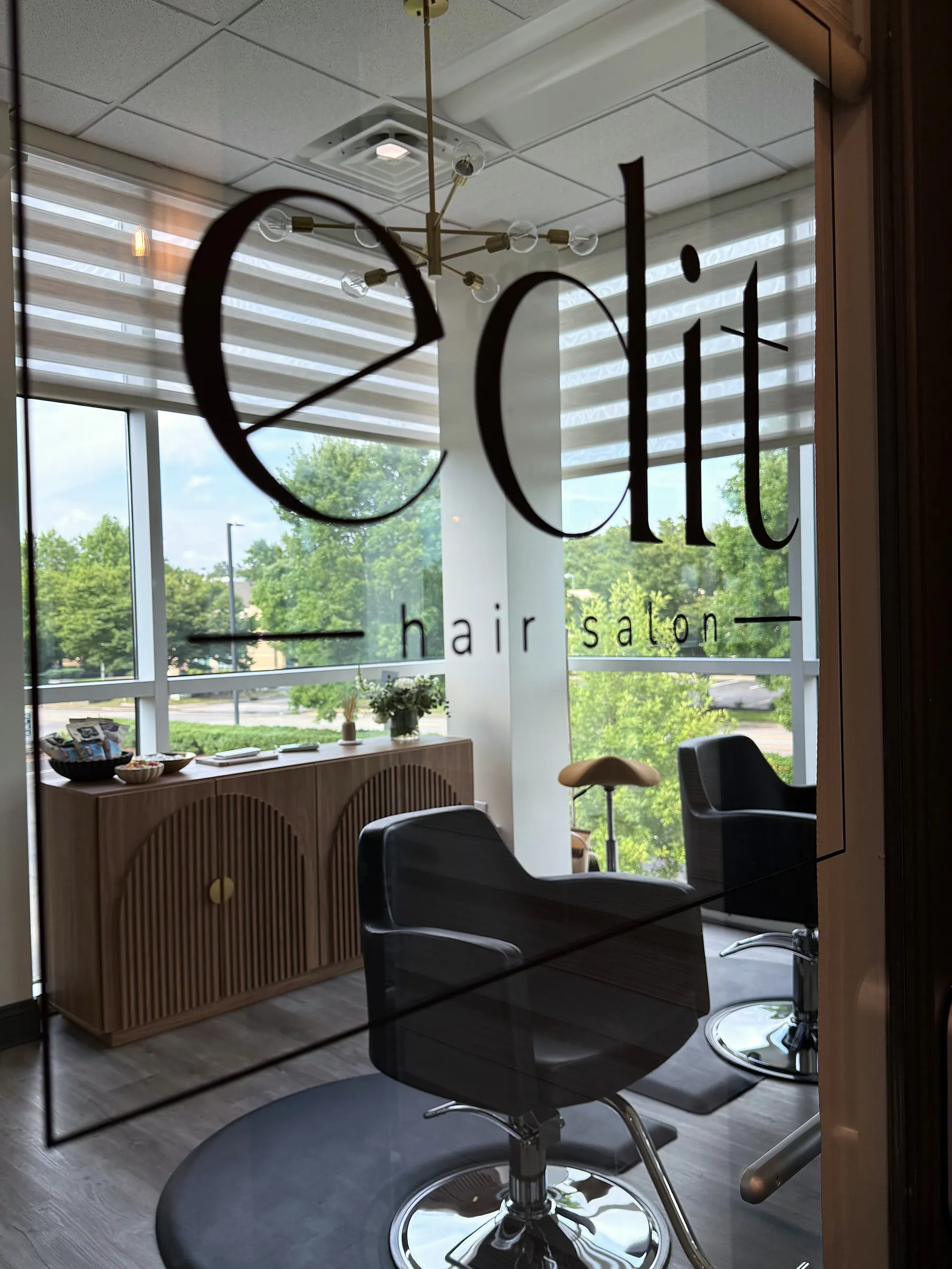 The edit hair salon entrance with etched glass logo